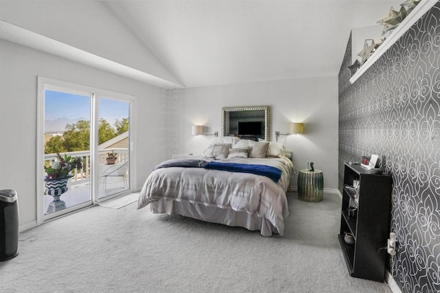 carpeted bedroom with high vaulted ceiling and access to outside