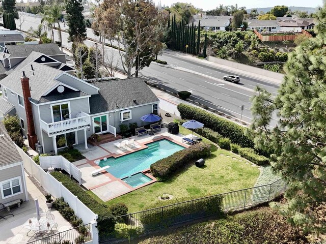 birds eye view of property with a residential view