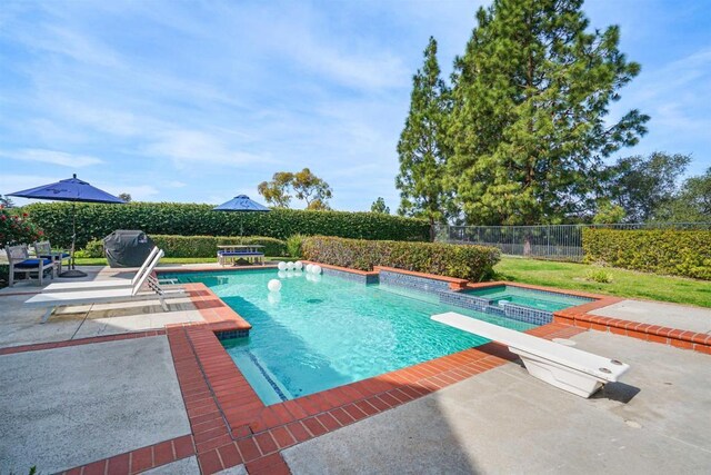 view of pool featuring a fenced in pool, a patio area, fence, and a diving board