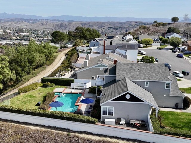 birds eye view of property with a residential view and a mountain view