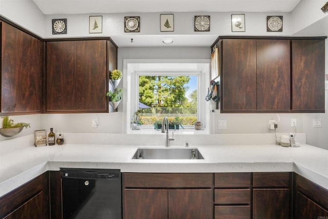 kitchen featuring a sink, dark brown cabinets, light countertops, and dishwasher