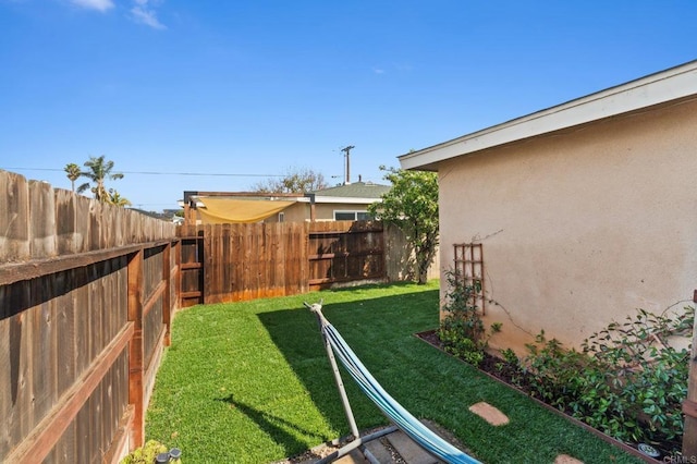 view of yard featuring a fenced backyard