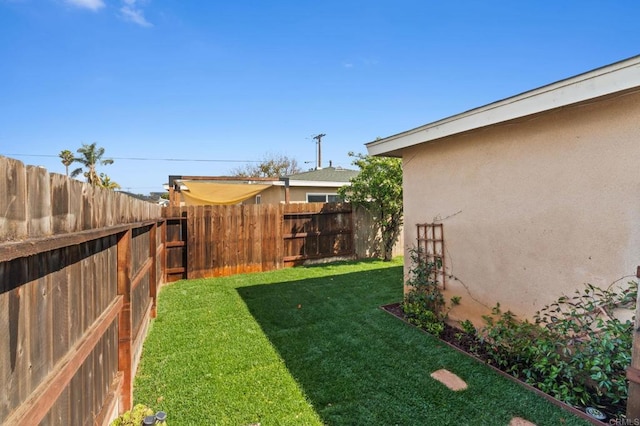 view of yard with a fenced backyard