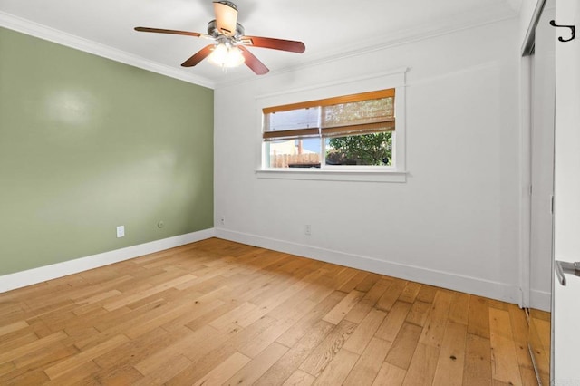 unfurnished room featuring ceiling fan, baseboards, light wood-style floors, and ornamental molding