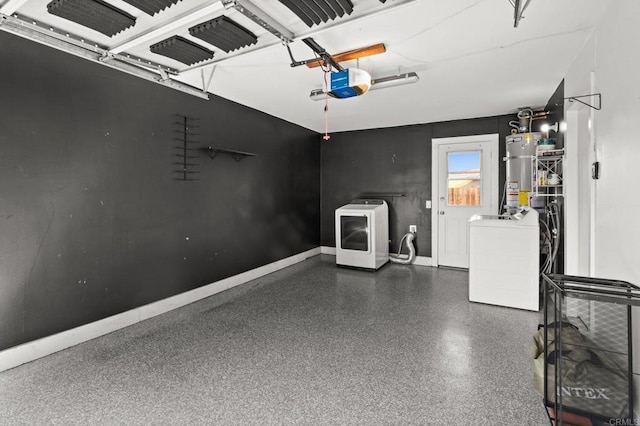 garage featuring washer and dryer, gas water heater, a garage door opener, and baseboards