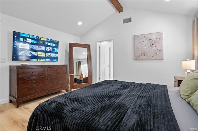 bedroom with vaulted ceiling with beams, baseboards, visible vents, and light wood-style floors