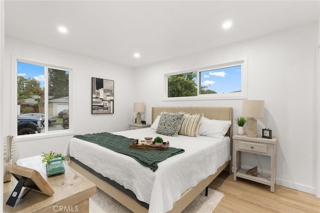 bedroom featuring light wood-style flooring, baseboards, and recessed lighting