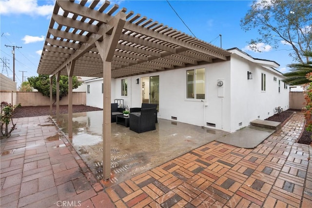 rear view of house with crawl space, a patio area, a fenced backyard, and stucco siding