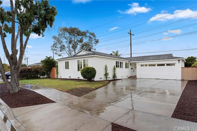 ranch-style home with driveway, crawl space, an attached garage, a front lawn, and stucco siding