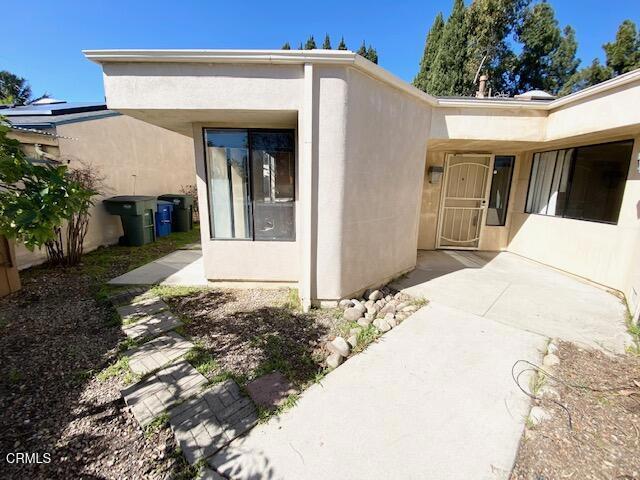 exterior space featuring stucco siding