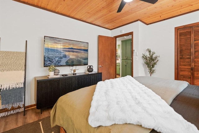 bedroom featuring a closet, wooden ceiling, wood finished floors, and a ceiling fan