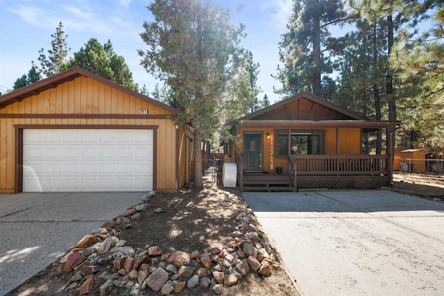 view of front facade with a porch and concrete driveway