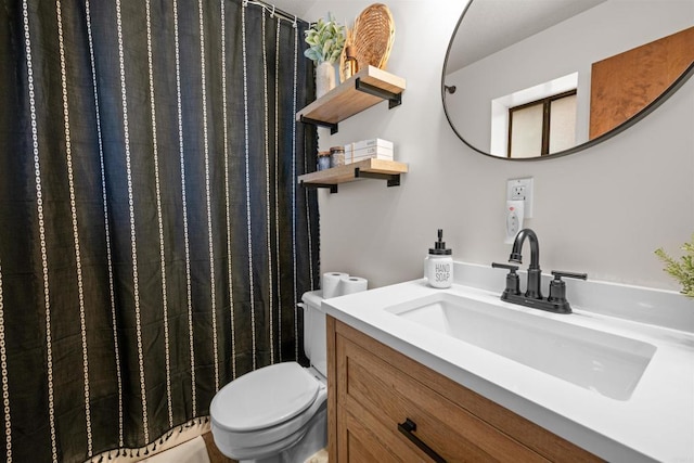 full bathroom featuring toilet and vanity