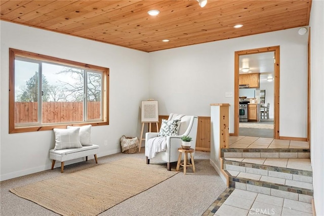 sitting room featuring wood ceiling, baseboards, tile patterned flooring, and recessed lighting