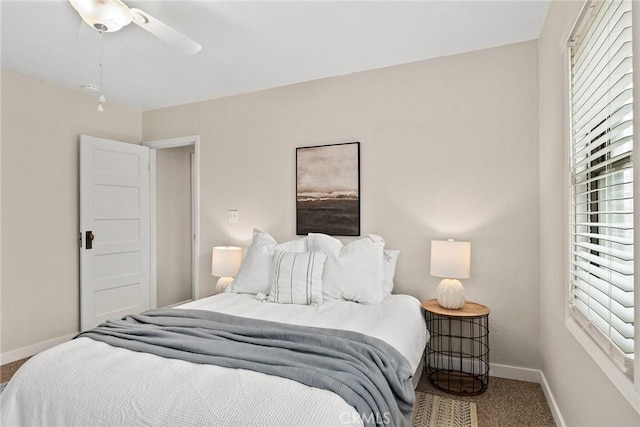 carpeted bedroom featuring ceiling fan and baseboards