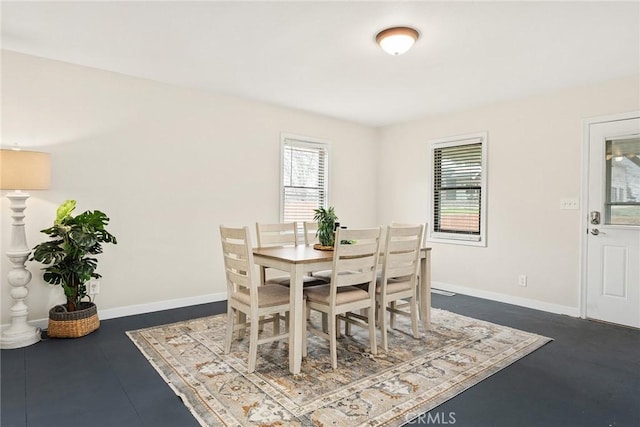 dining room with baseboards