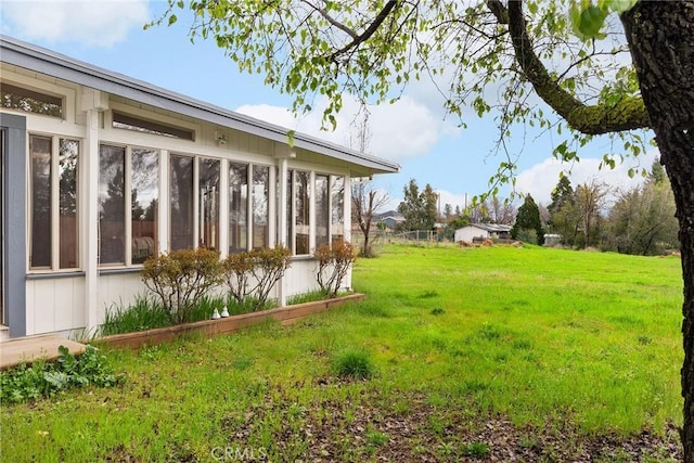 view of yard with a sunroom