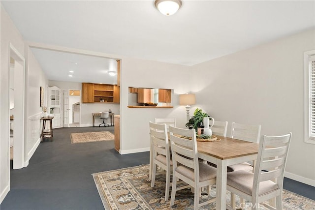 dining room featuring baseboards