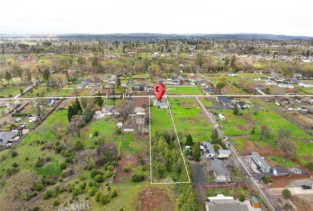 birds eye view of property with a residential view