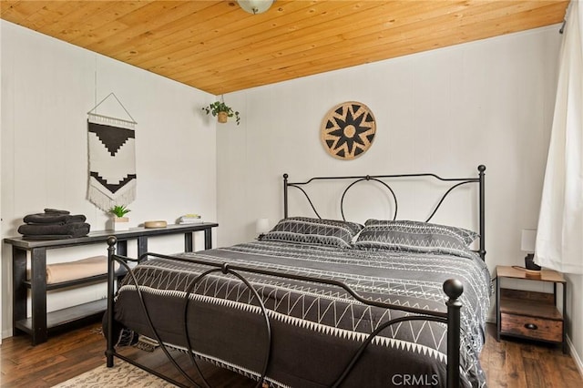 bedroom with wood finished floors and wood ceiling