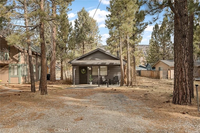 view of front of home featuring fence