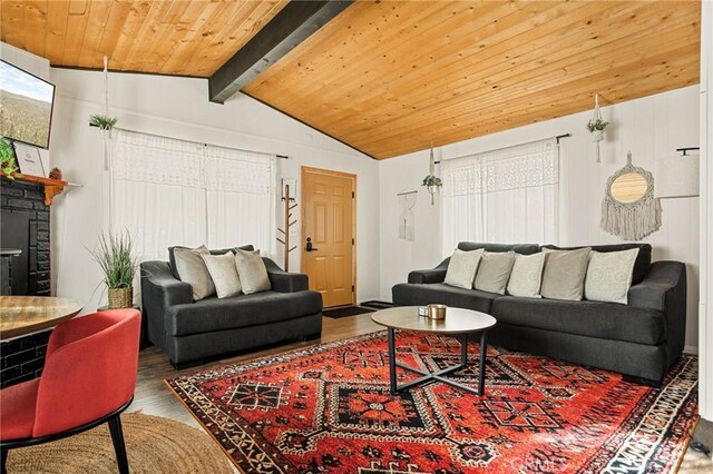 living room with wood ceiling, a stone fireplace, lofted ceiling with beams, and wood finished floors