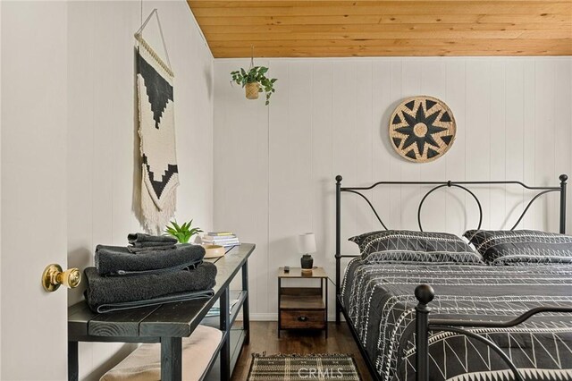 bedroom featuring wood ceiling and wood finished floors