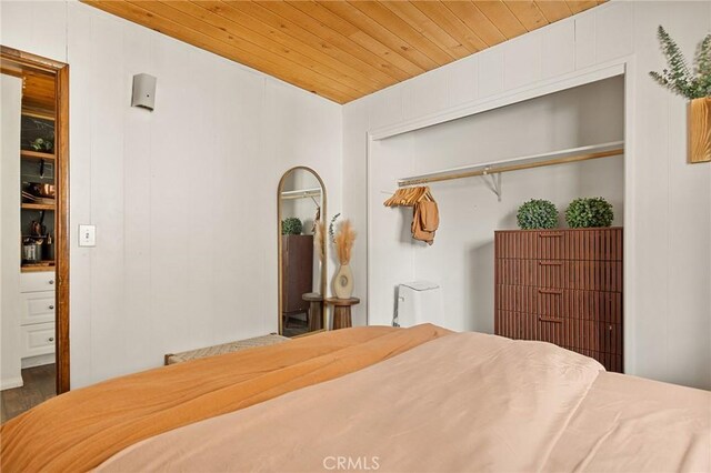 bedroom featuring a closet and wood ceiling