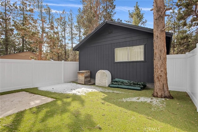 view of outbuilding featuring a fenced backyard