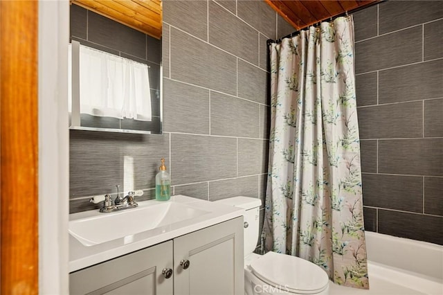 full bathroom with toilet, vanity, tile walls, backsplash, and shower / bathtub combination with curtain