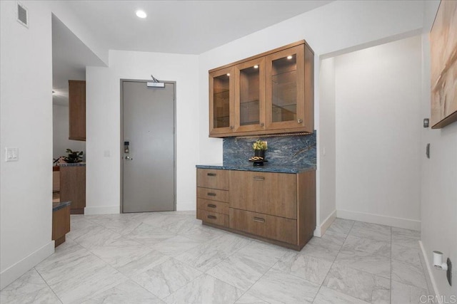 hallway with baseboards, recessed lighting, visible vents, and marble finish floor