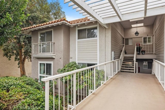 exterior space featuring a pergola and stairs