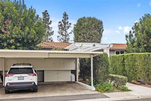 exterior space with a carport