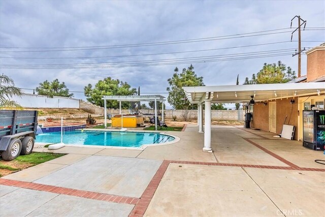 view of swimming pool featuring a hot tub, a fenced in pool, a patio, fence, and a pergola