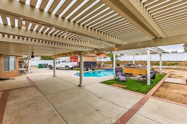 view of swimming pool featuring a patio area, a fenced backyard, and a pergola