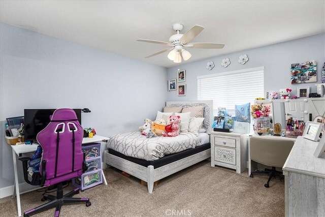 bedroom with light carpet and ceiling fan