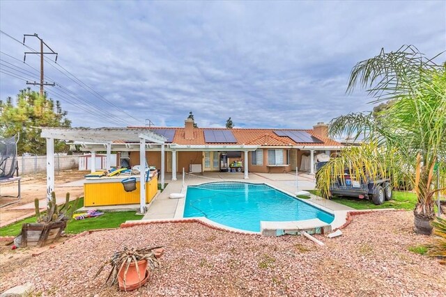 view of pool with a fenced backyard, a jacuzzi, a fenced in pool, a pergola, and a patio area