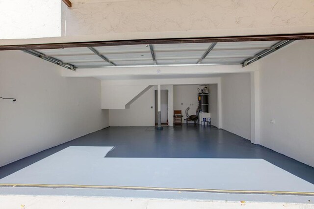 garage featuring secured water heater