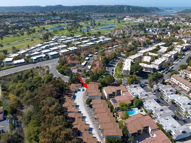 drone / aerial view with a residential view and golf course view