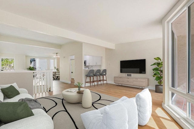 living room with light wood-style floors and baseboards