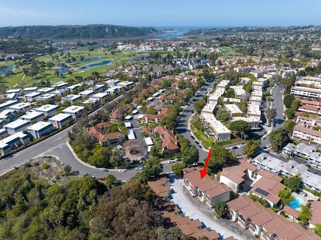 bird's eye view with a water view, golf course view, and a residential view