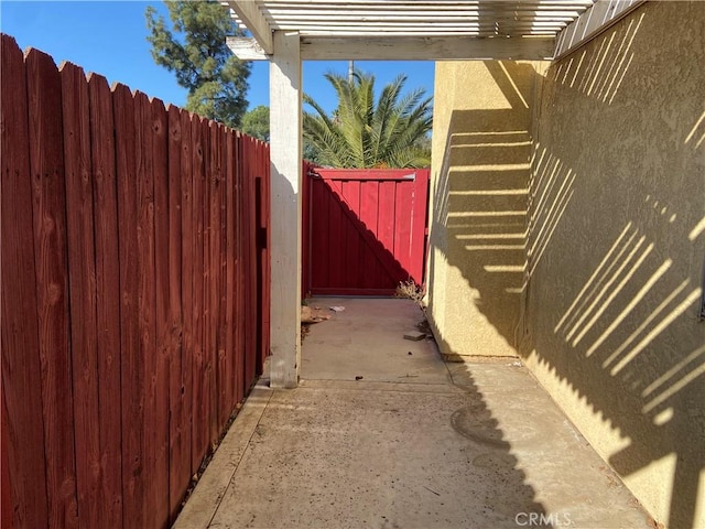 view of property exterior featuring a gate and fence