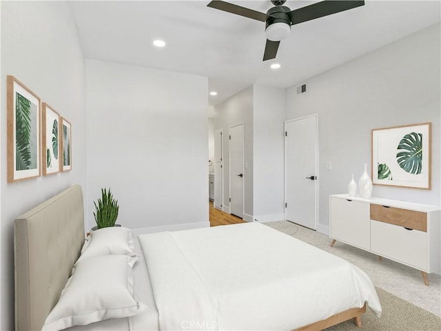 bedroom with ceiling fan, recessed lighting, baseboards, and light carpet