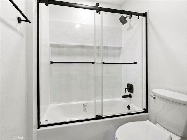 bathroom with enclosed tub / shower combo and toilet