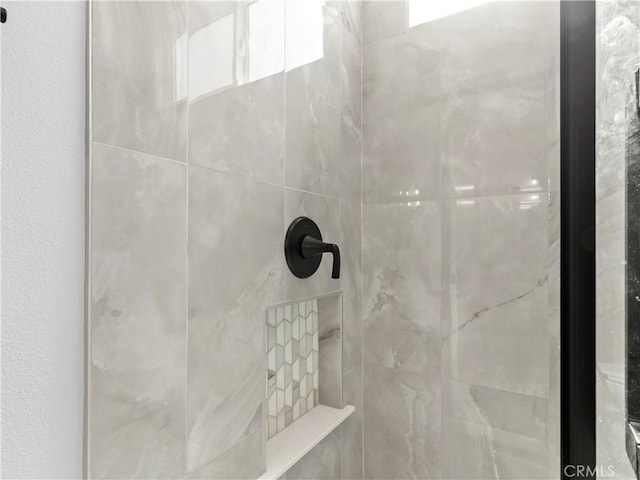 details featuring a tile shower