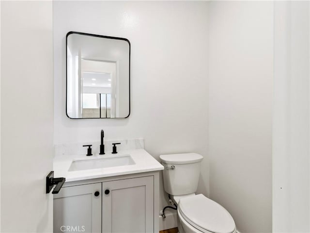 half bath with toilet and vanity