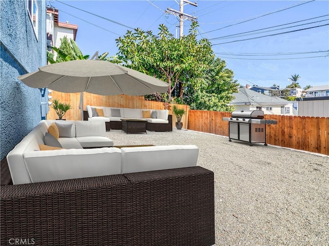 view of patio / terrace with area for grilling, an outdoor hangout area, and a fenced backyard