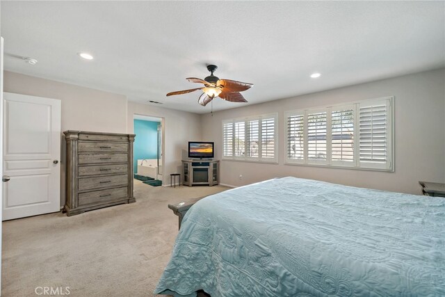 carpeted bedroom with ceiling fan, visible vents, and recessed lighting