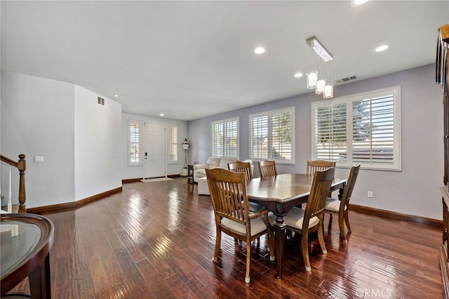 dining area featuring recessed lighting, visible vents, dark wood-type flooring, baseboards, and stairs