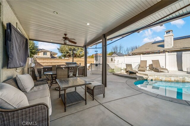 view of patio / terrace featuring ceiling fan, outdoor dining area, a fenced backyard, and a fenced in pool